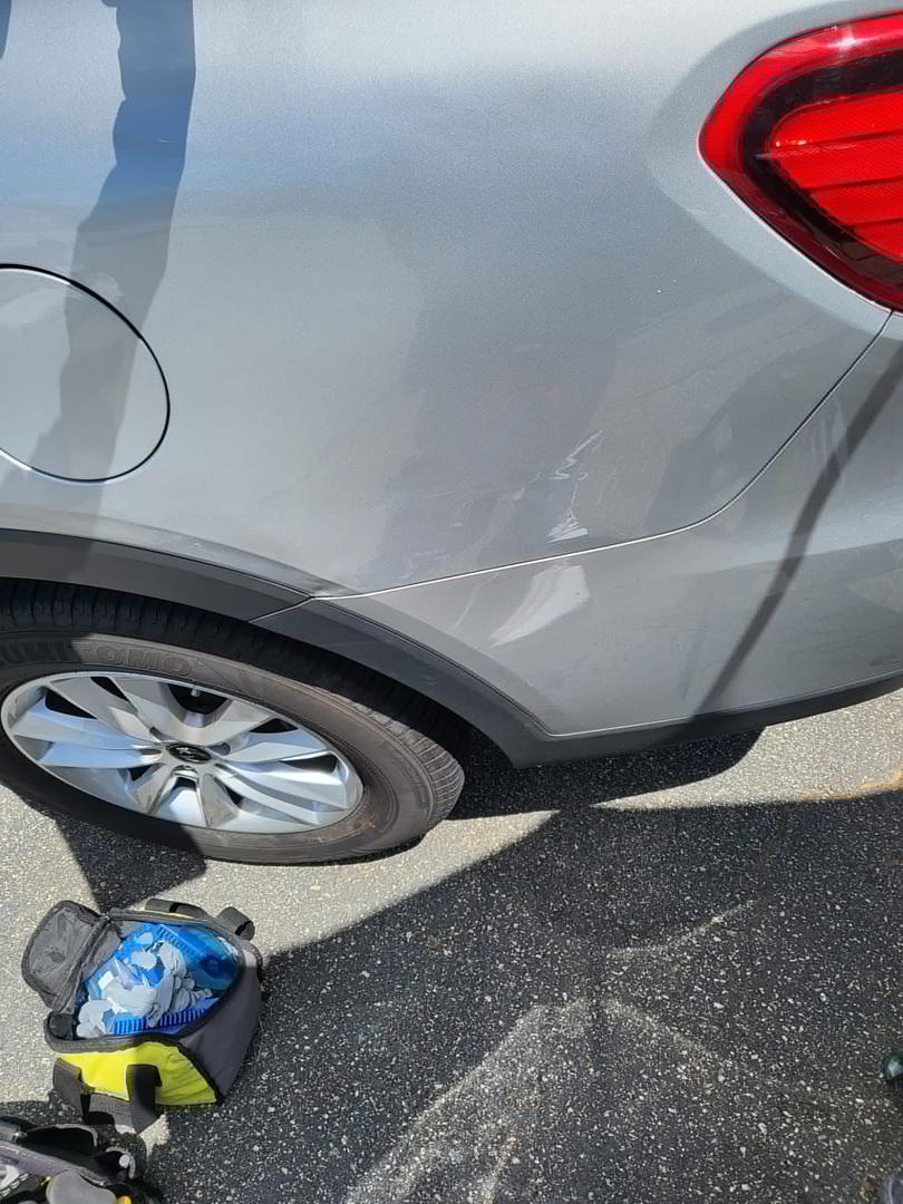 After: quarter panel dent removed with paintless dent repair, factory finish preserved
