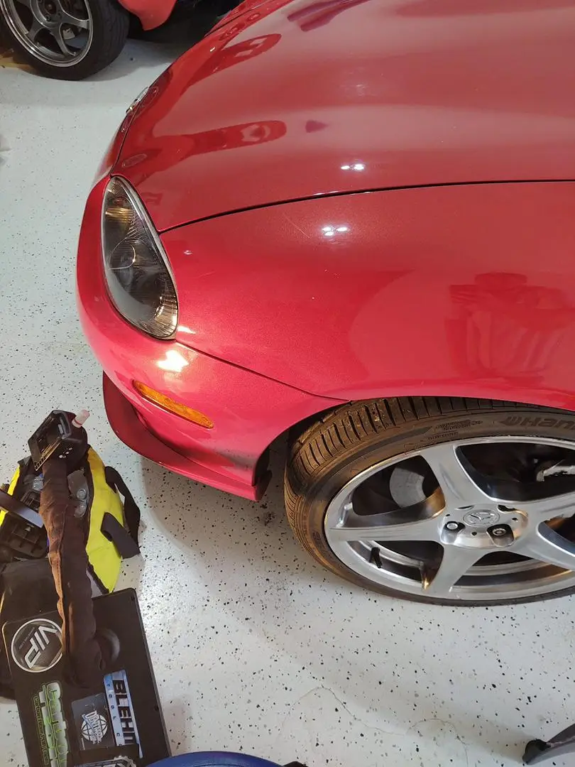 dent pdr result red car after fixing dent