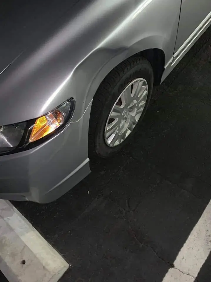 before dent fix on a sedan customer car before dent repair